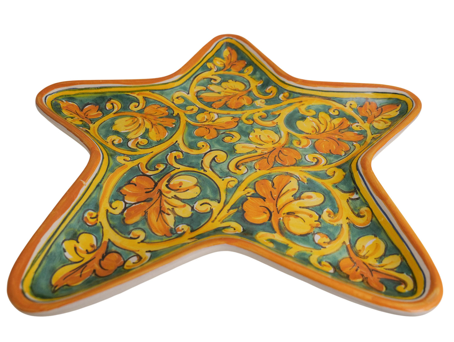 Star tray with spiral vine leaf decoration on green background