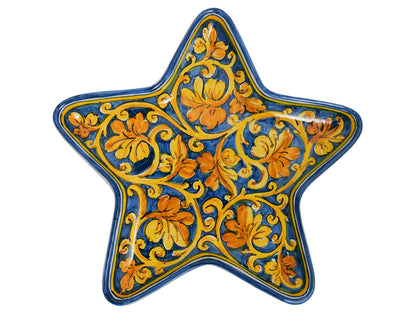 Star tray with spiral vine leaf decoration on a blue background
