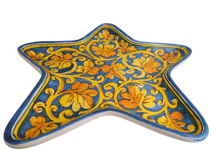 Star tray with spiral vine leaf decoration on a blue background