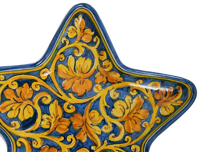 Star tray with spiral vine leaf decoration on a blue background